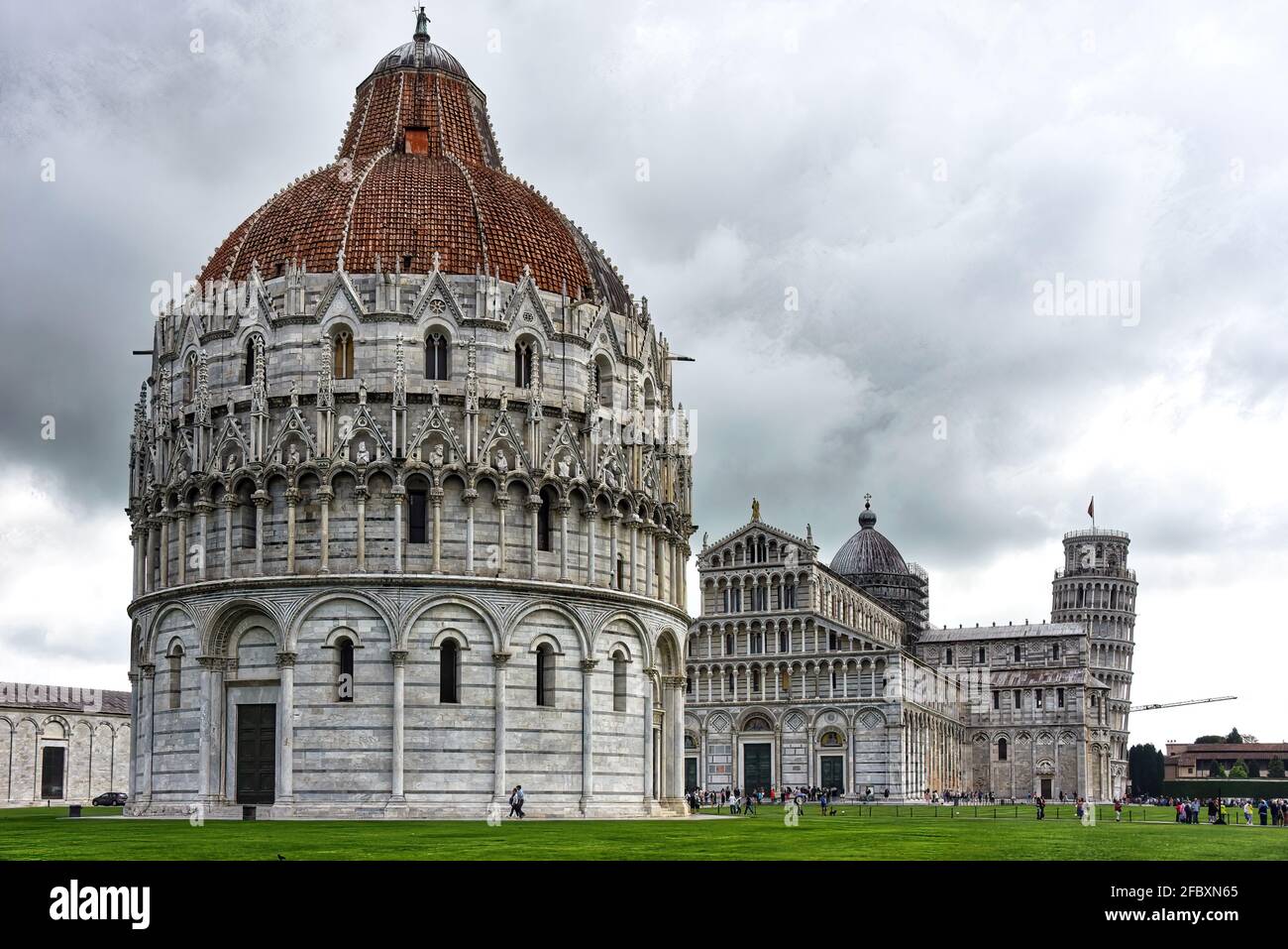 The Pisa Baptistery, the Pisa Cathedral and the Tower of Pisa located in the Piazza dei Miracoli (Square of Miracles) in Pisa, Italy. Stock Photo