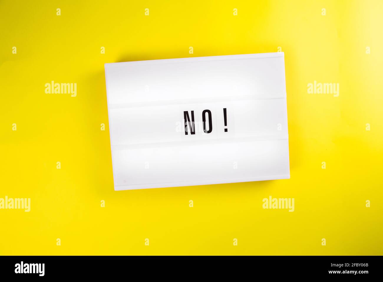 Lightbox with text NO isolated on yellow background, danger, ban, stop, embargo Stock Photo