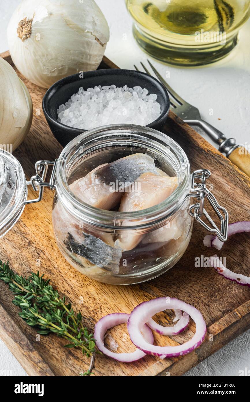 Pickled herring in oil, on white background Stock Photo Alamy