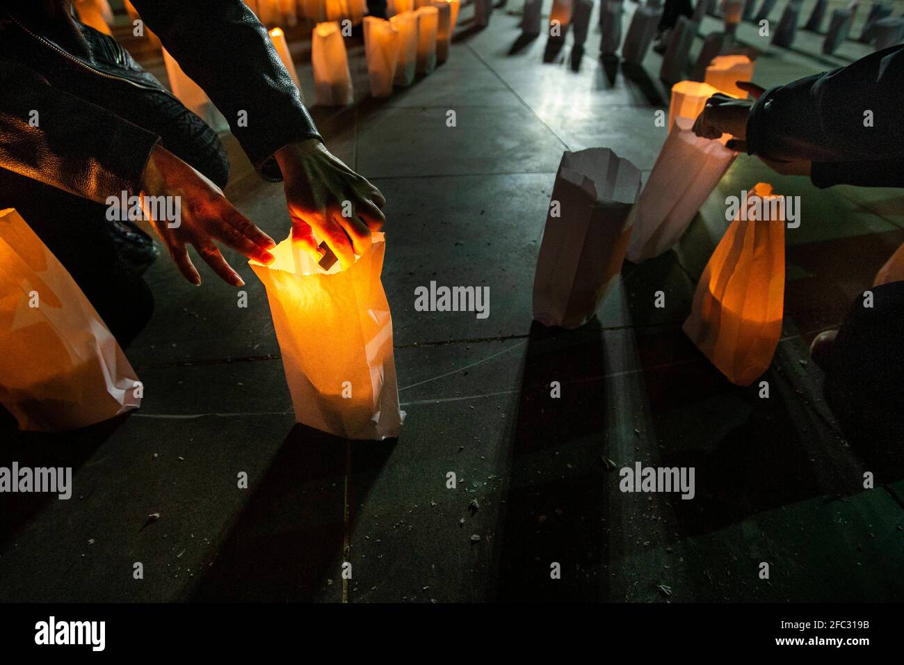 Bikfaya, Lebanon. 23rd Apr, 2021. People relight candles that have gone