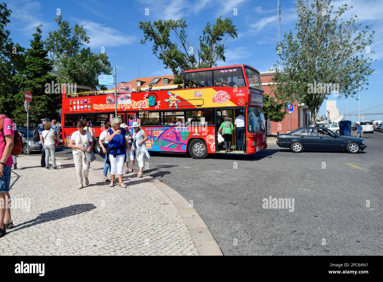 Touristic red colorful tour bus in European capital, Lisbon Portugal