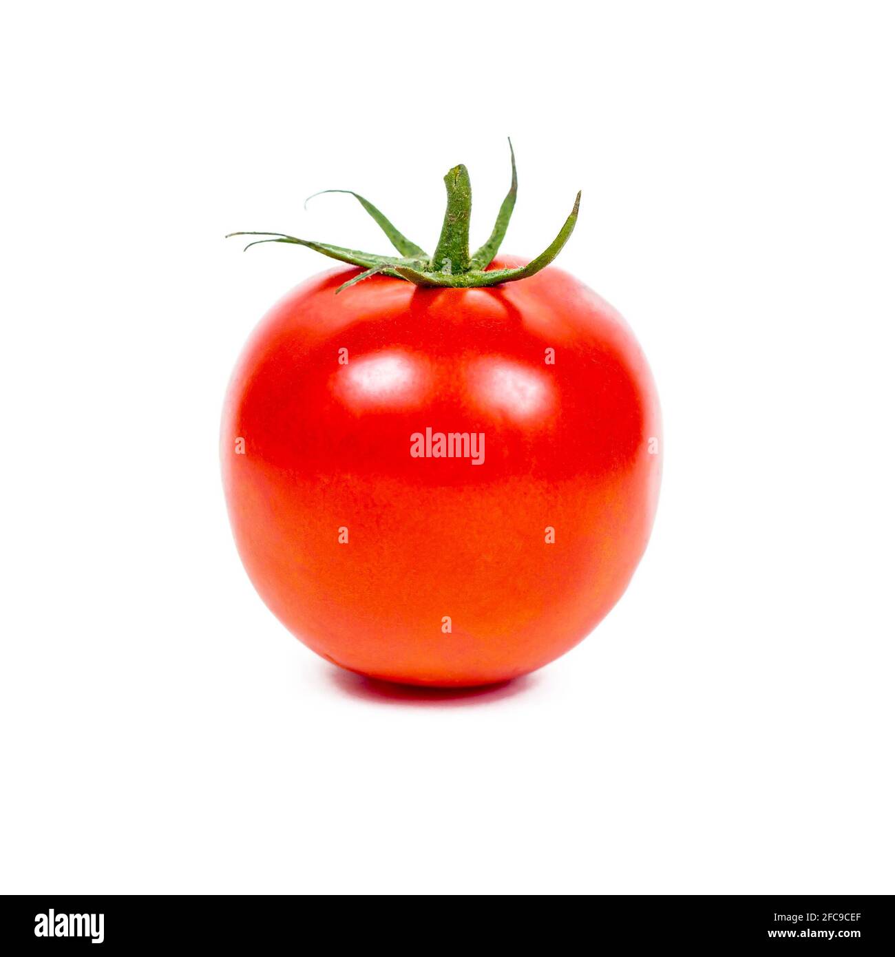 Fresh whole tomato isolated on white background. Stock Photo