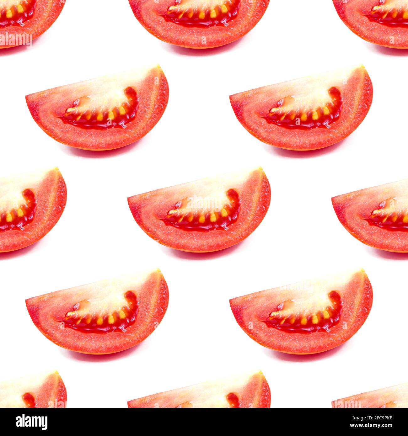 Red tomato slices repeat seamless pattern on white background. Stock Photo