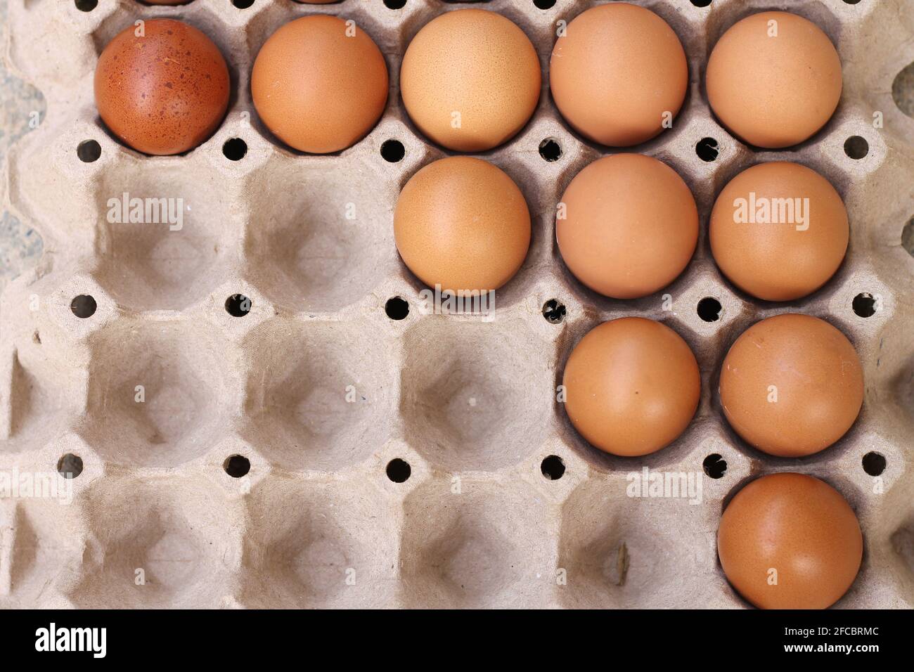 Brown eggs in paper trays For cooking Stock Photo