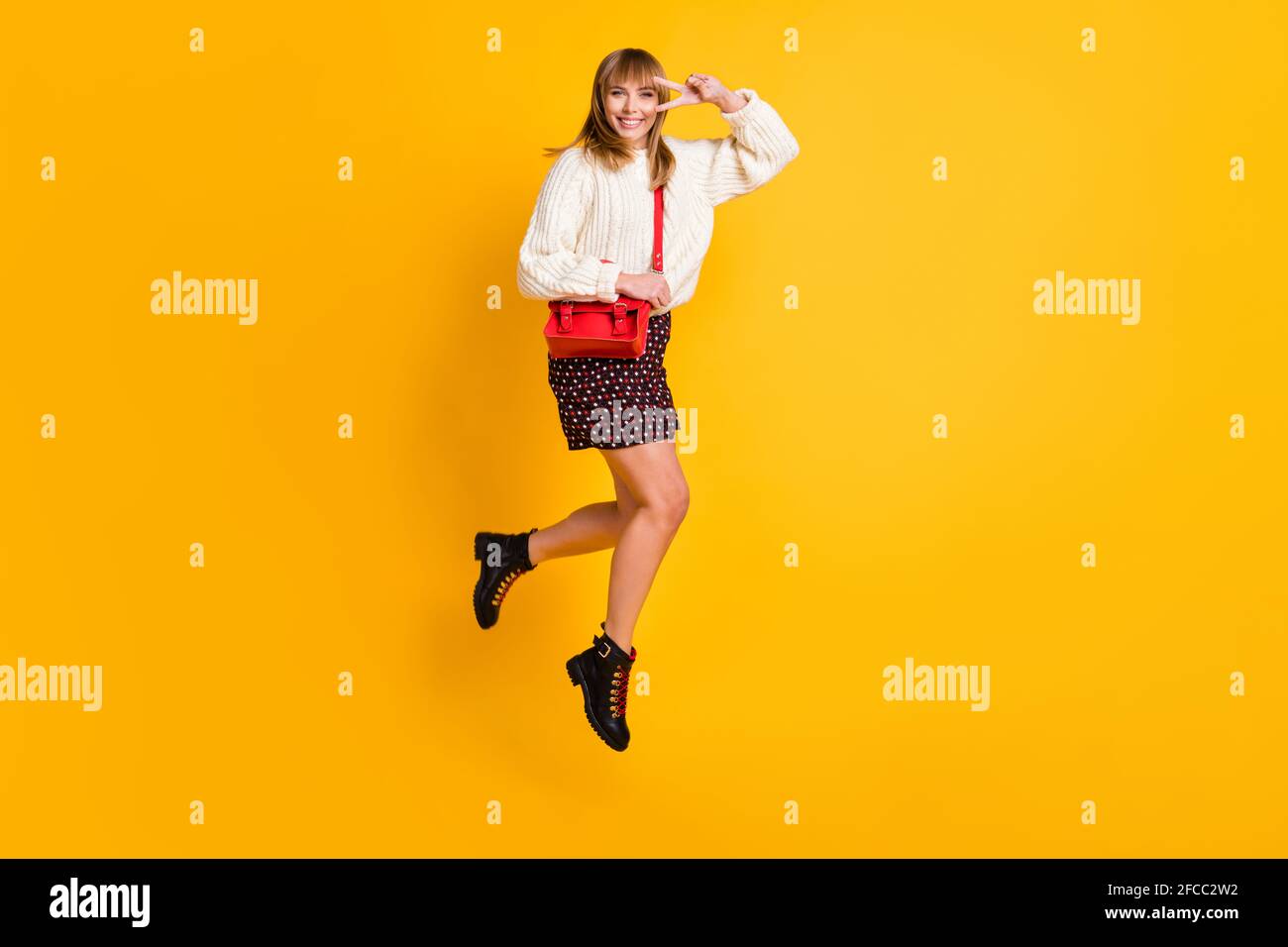 Full size profile portrait of attractive lady jumping fingers show v