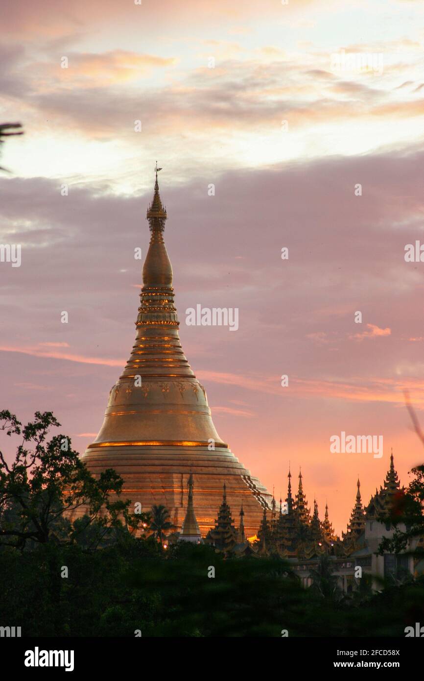 YANGON, MYANMAR- MAY 20, 2009: Shwedagon Pagoda at sunset, in the center of Yangon (Rangoon), is the most sacred Buddhist stupa in Myanmar and one of Stock Photo