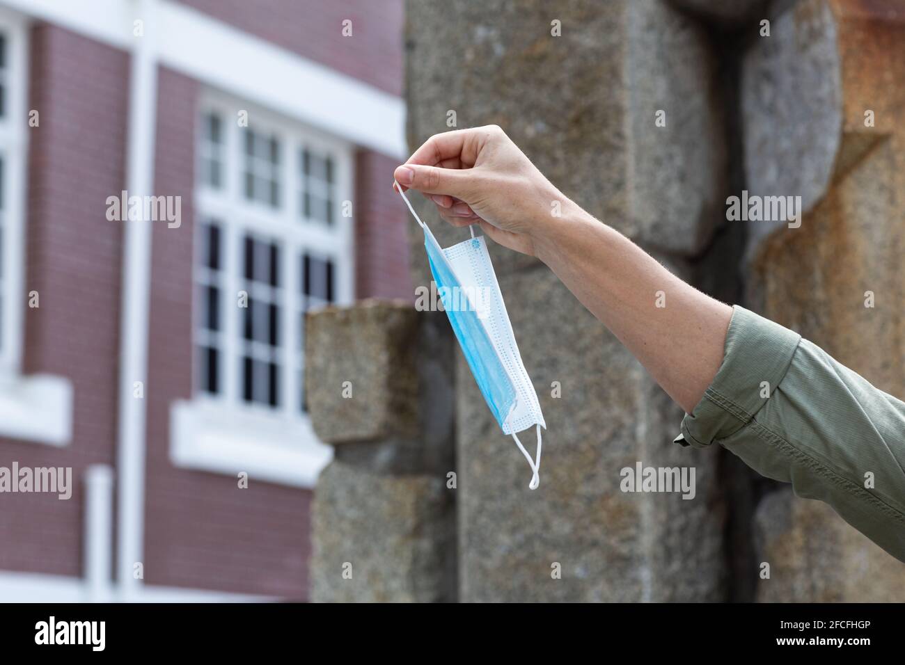 Man holding mask face hi-res stock photography and images - Alamy
