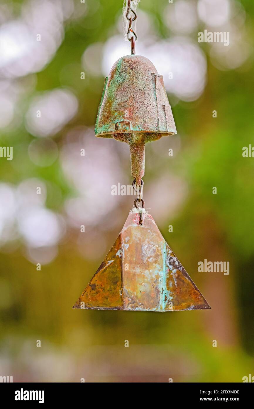 Wind chime hanging in the summer garden Stock Photo
