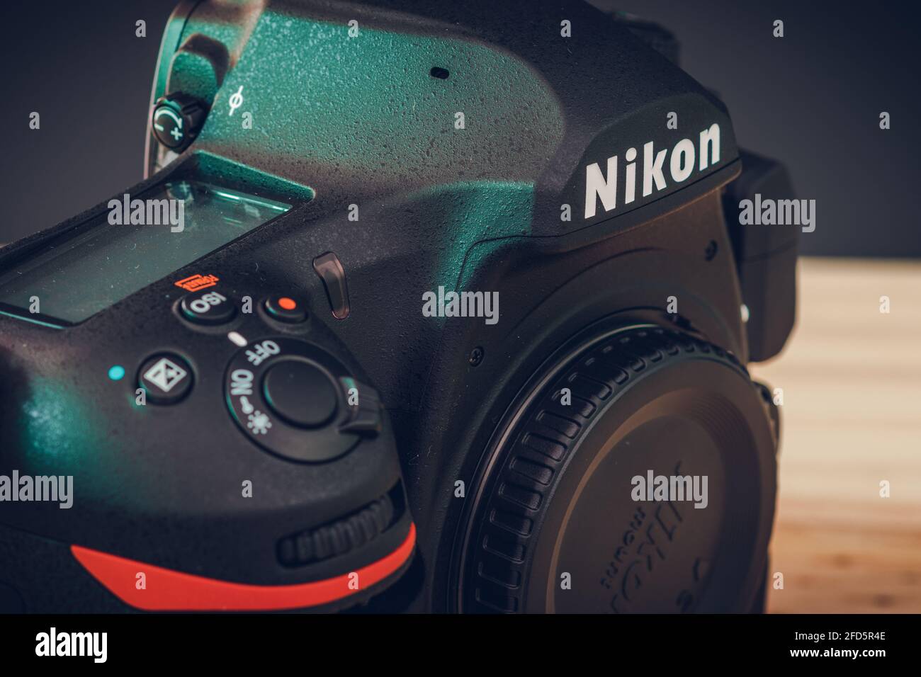 Galle, Sri Lanka - 02 17 2021: Nikon D850 DSLR body with camera body cap, top LCD display, and front dials and on off switch close up. Modern professi Stock Photo