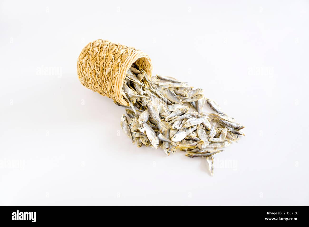 asian traditional dried salty small fish, calcium cooking, isolated on white background Stock Photo