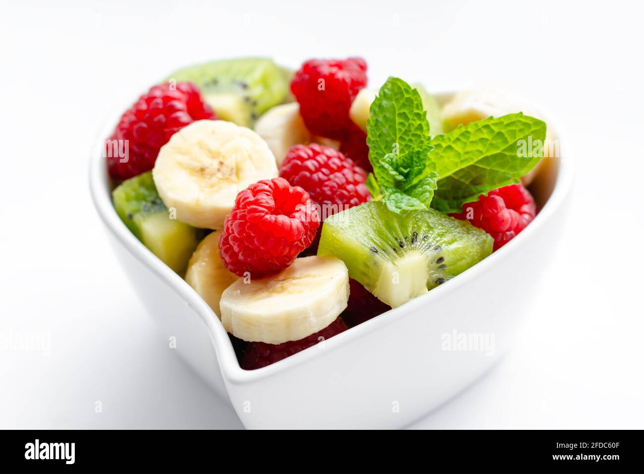 Fruit salad bowl banana raspberry hi-res stock photography and images ...