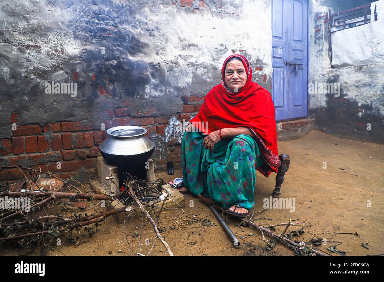 portrait of senior indian woman,making food in her house. Stock Photo