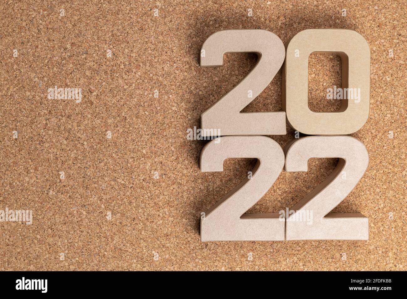 The year twenty twenty-two in large cardboard numbers on a cork background  Stock Photo - Alamy