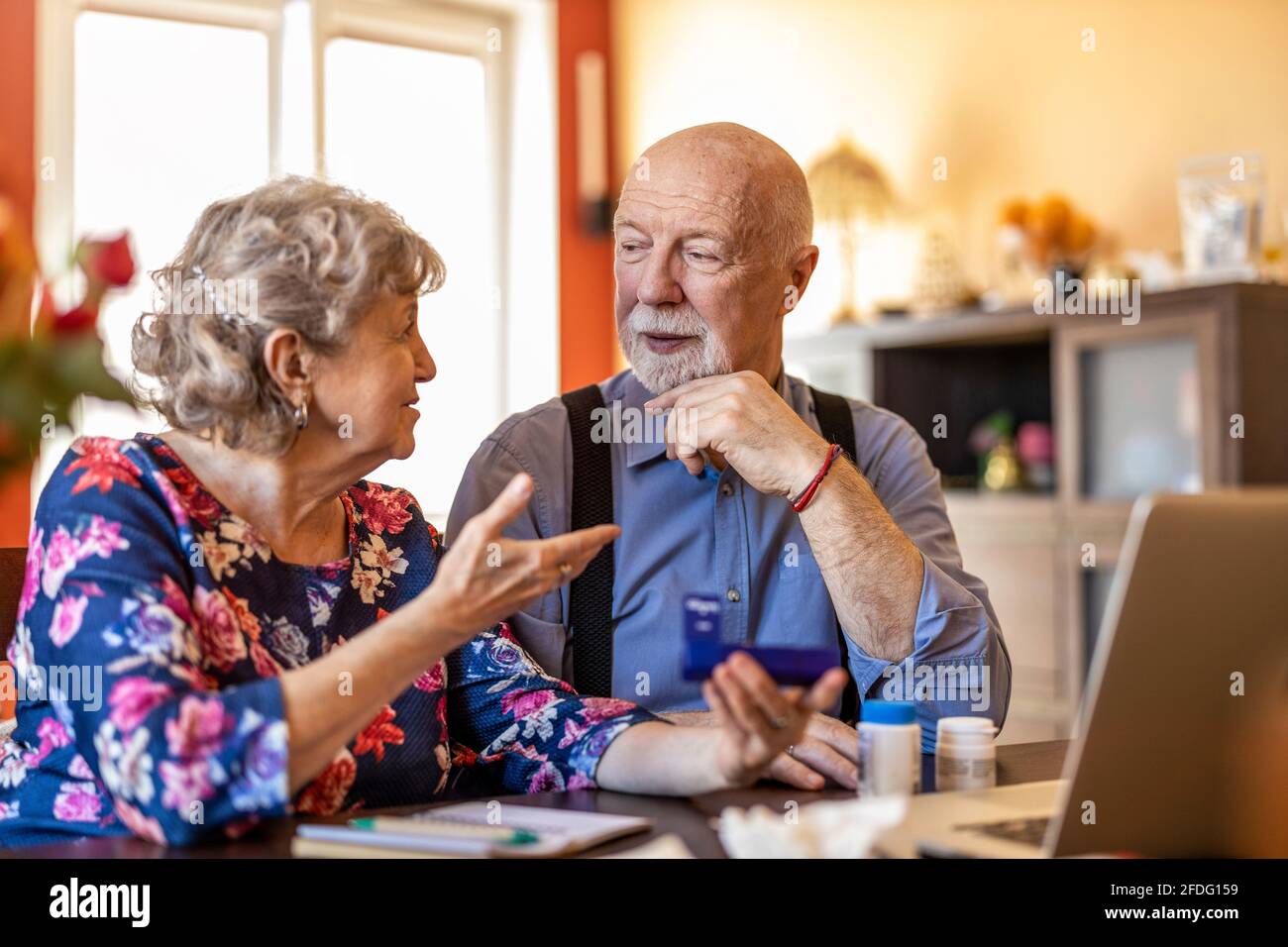 Senior couple using a laptop at home Stock Photo