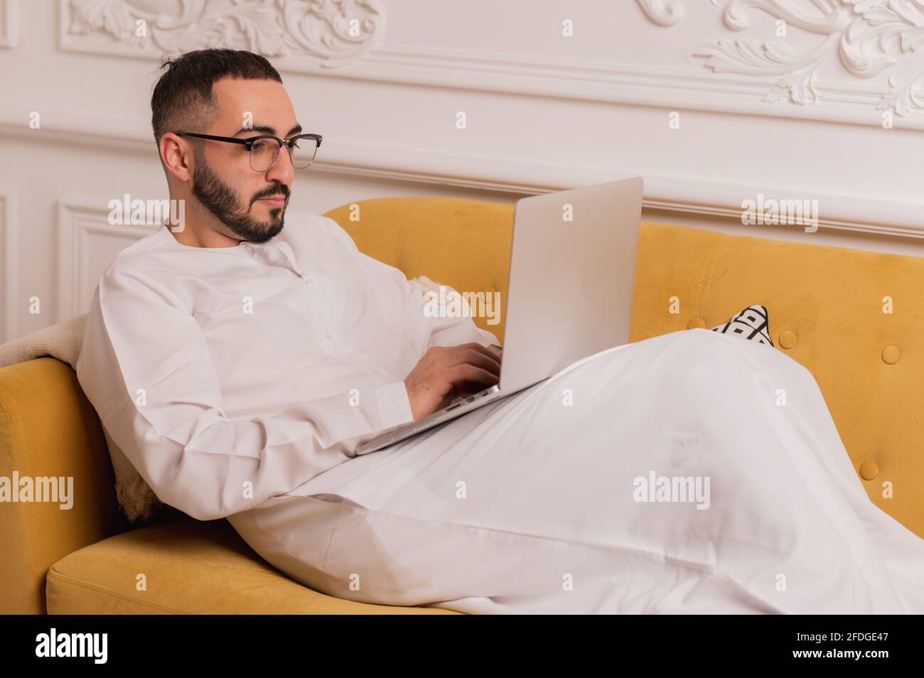 arabic programmer working on laptop at home Stock Photo