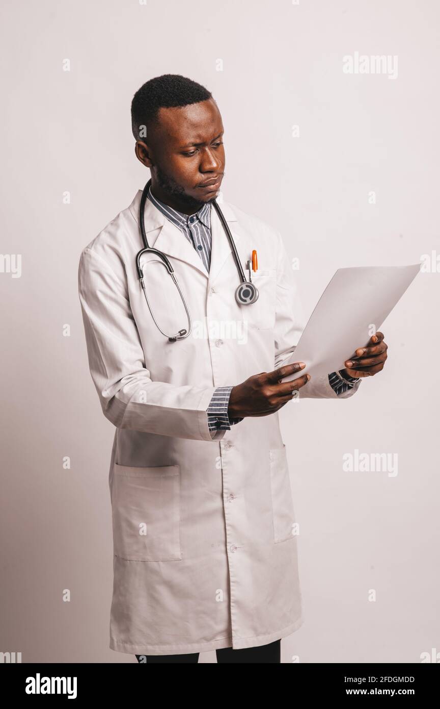 African-American black young doctor man isolated white background. Stock Photo