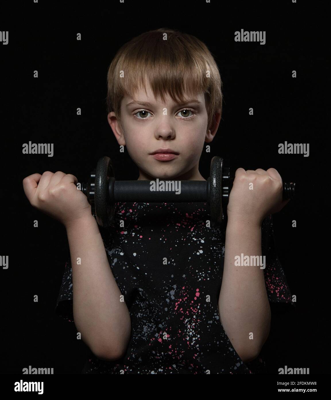 Young boy posing for studio shot Stock Photo