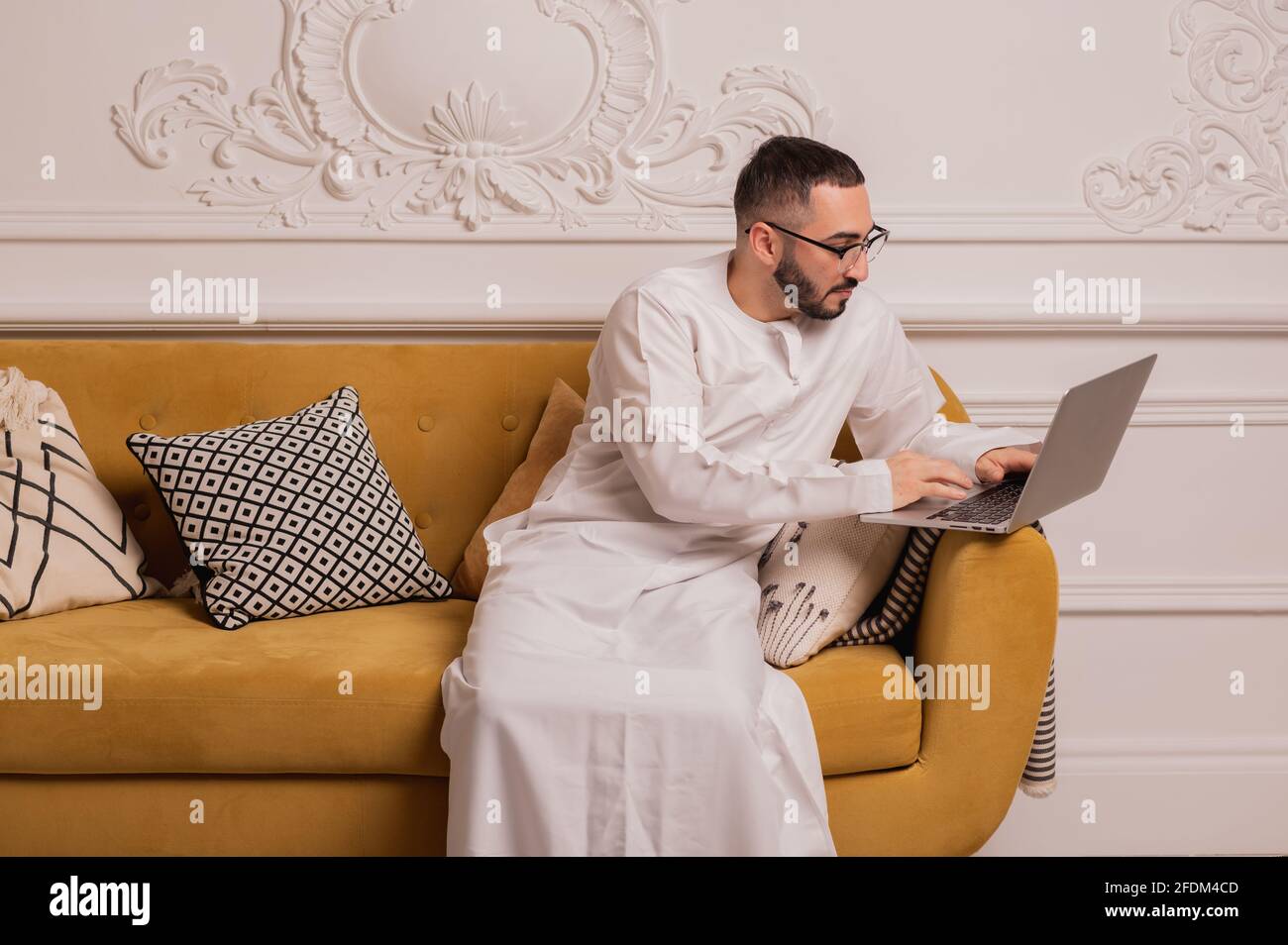 arabic programmer working on laptop at home Stock Photo