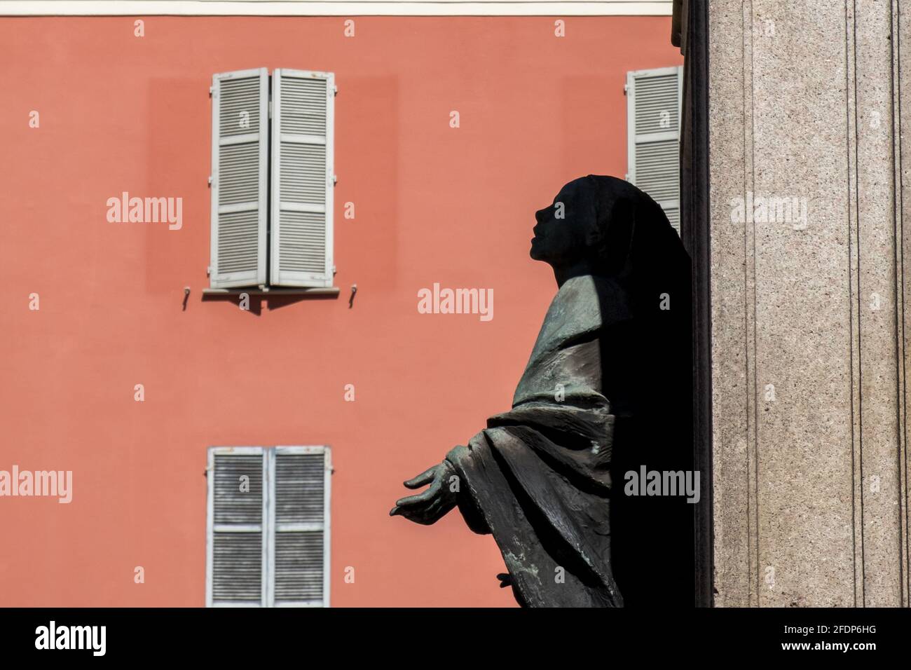 Side profile of a bronze sculpture looking to god, Piacenza, Italy Stock Photo