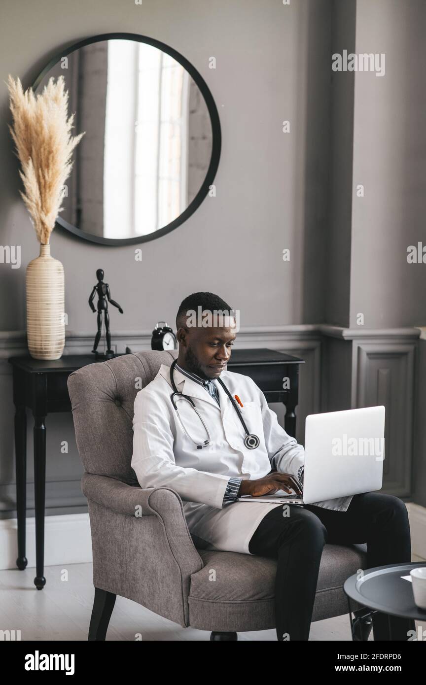 Happy positive black doctor talk on video call with patient, smiling ...