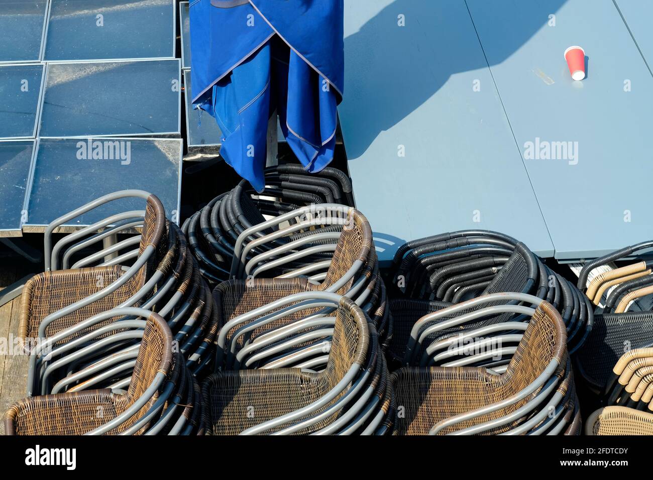 Gastronomy lockdown, closed restaurant,cafe or bar due to corona epidemic, chairs and tables stacked,symbol picture Stock Photo