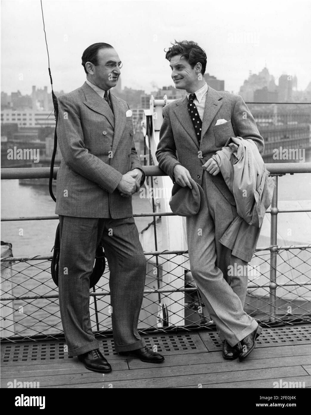 BEN GOETZ (in charge of production for MGM at Denham Studios in England) with ROBERT DONAT arriving on the Normandie ocean liner in New York to deliver to Hollywood a print of the second British-made MGM film THE CITADEL 1938 director KING VIDOR novel A.J. Cronin screenplay Ian Dalrymple Frank Wead and Elizabeth Hill additional dialogue Emlyn Williams producer Victor Saville Metro Goldwyn Mayer British Studios Stock Photo
