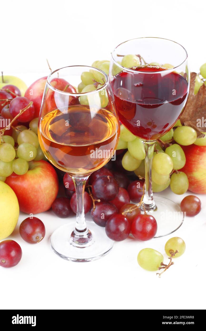 Still life with wine and fruits on a white background Stock Photo - Alamy