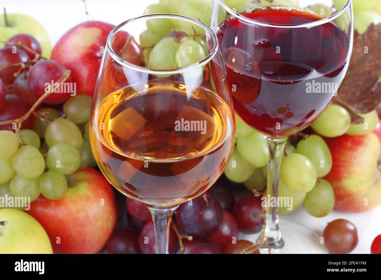 Still life with wine and fruits on a white background Stock Photo - Alamy