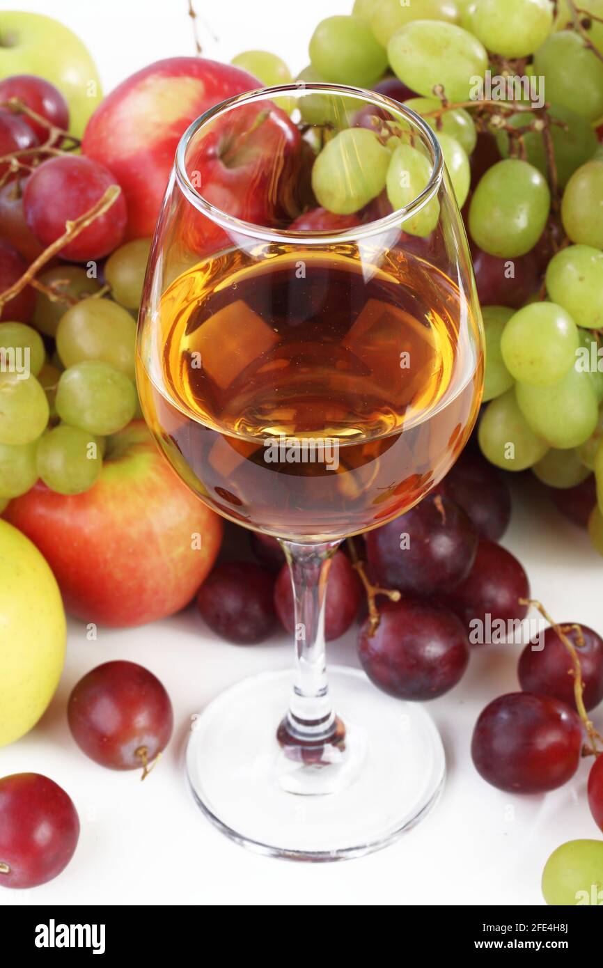 Still life with wine and fruits on a white background Stock Photo - Alamy
