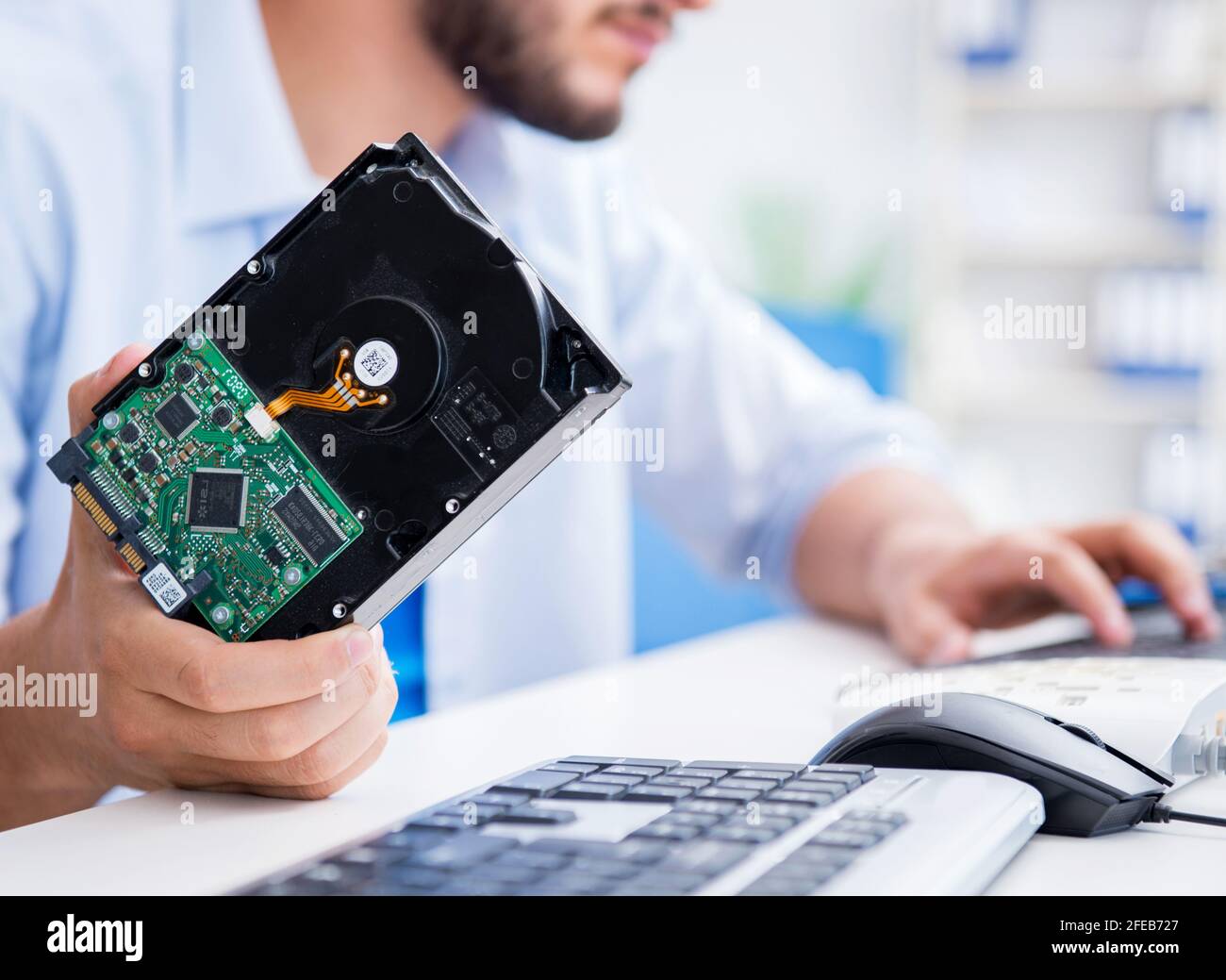 the-technician-with-broken-hard-drive-stock-photo-alamy