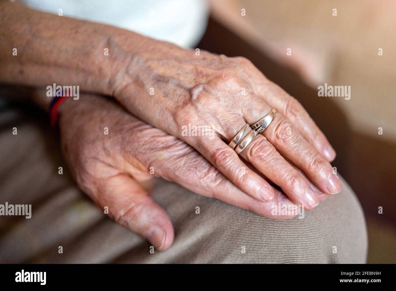 Close up of senior couple holding hands Stock Photo