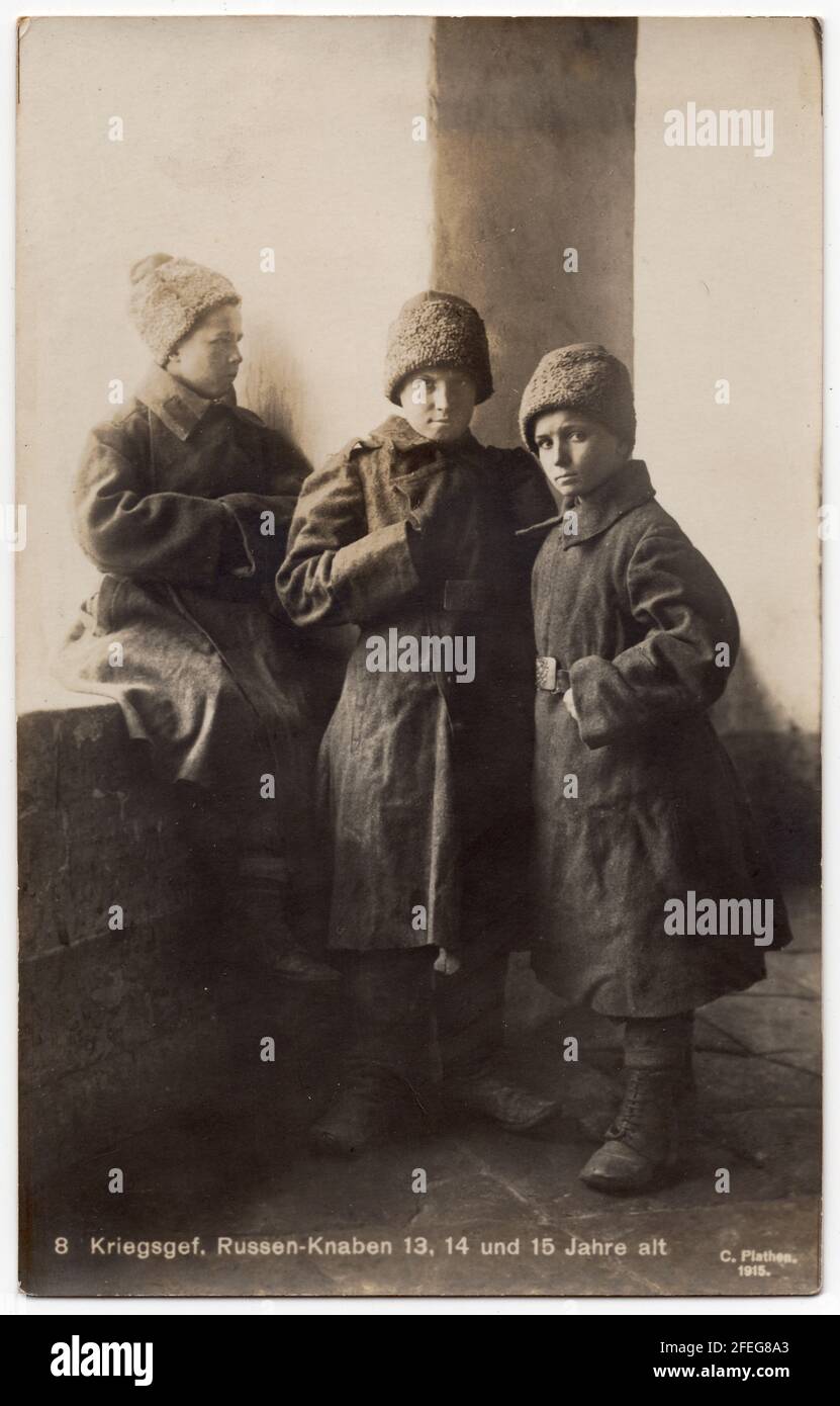 Three Russian boys at age 13, 14 and 15 interned as Russian prisoners of war pictured probably in one of the German POW Camps during the First World War depicted in the black and white vintage photograph by German photographer Karl Plathen from Leipzig dated from 1915. Text in German means: Prisoners of war. Russian boys at age 13, 14 and 15. Courtesy of the Azoor Photo Collection. Stock Photo