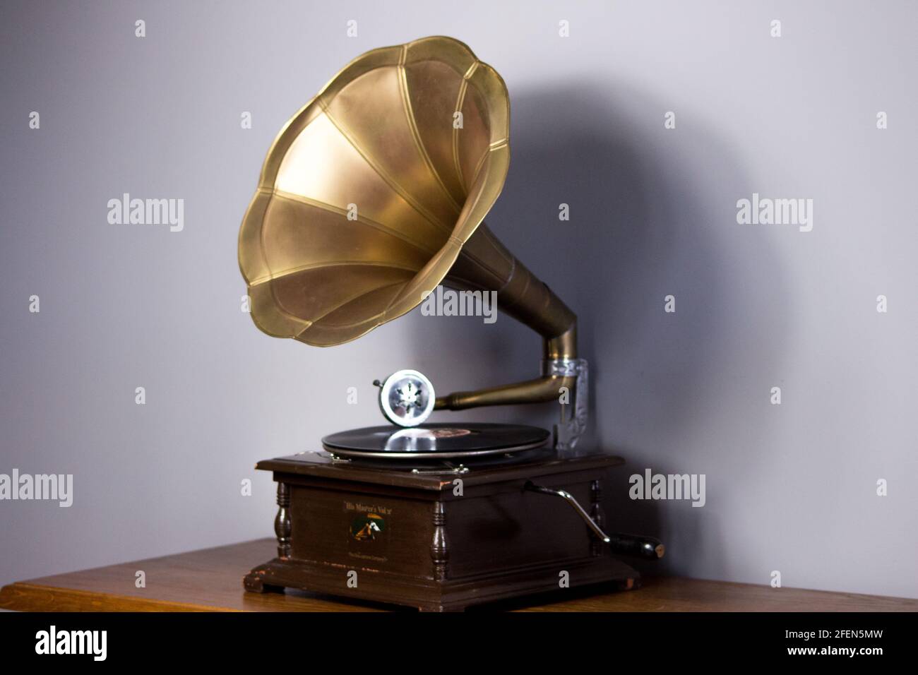 Old gramophone with a plate record. Portable wind-up gramophone. Patephone Stock Photo