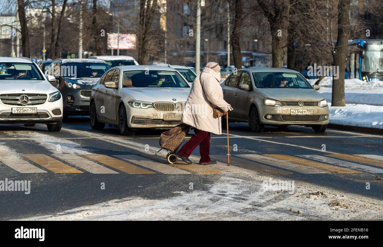 Old woman walking stick crossing hi-res stock photography and images ...