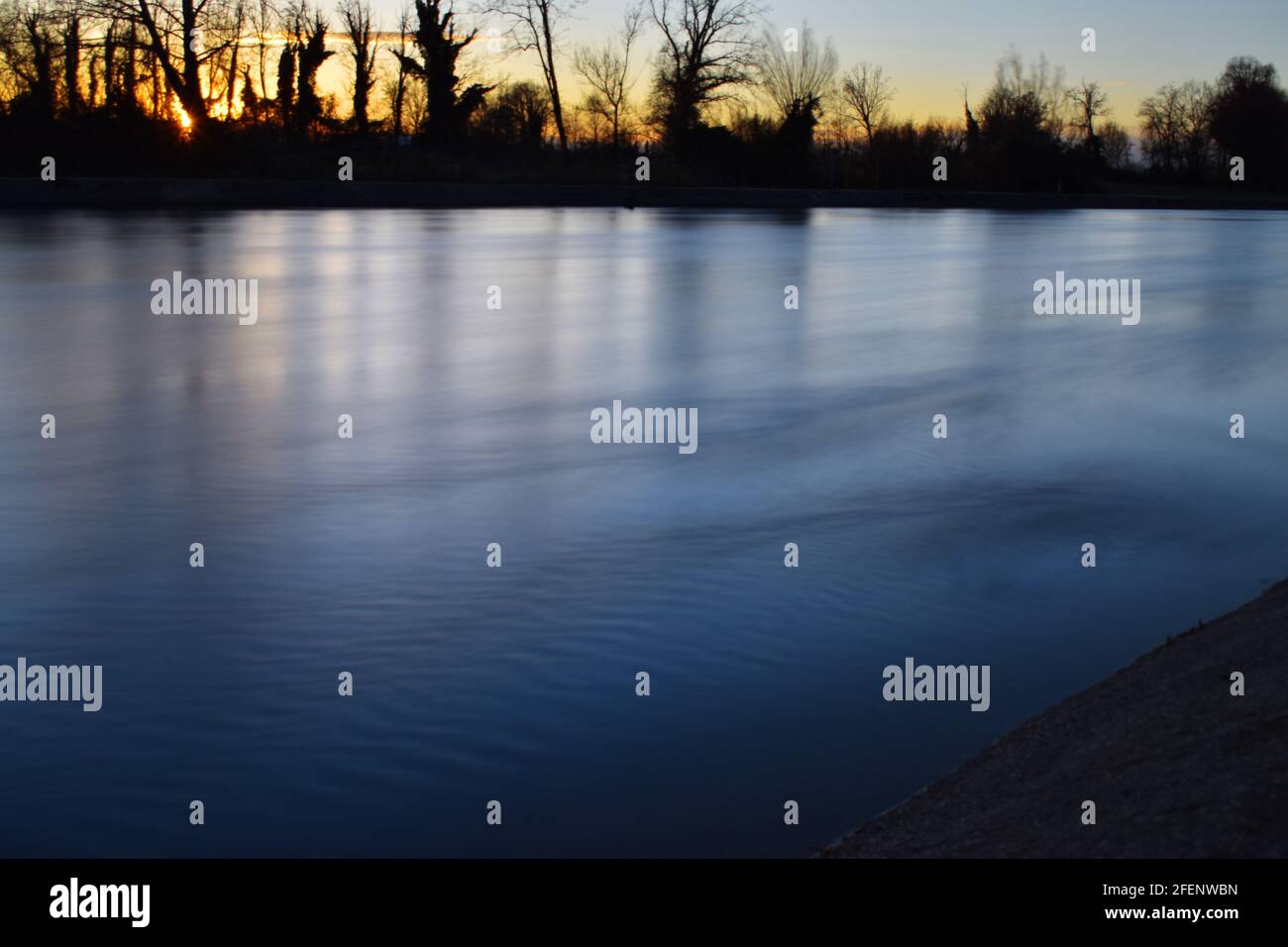 amazing sunset on the Muzza river Stock Photo - Alamy