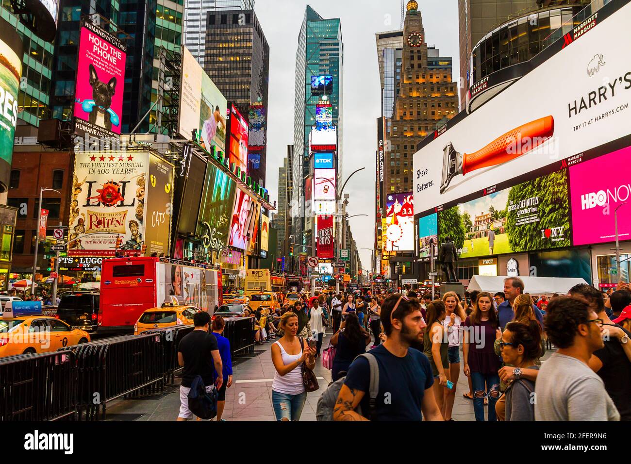 Times Square on a busy afternoon wıth full of tourists and heavy traffic Stock Photo
