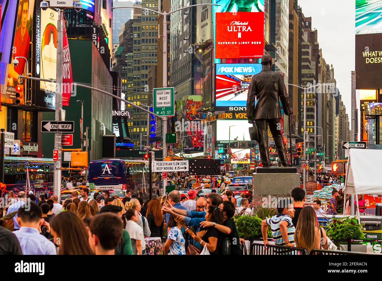 Crowds of people at Times Square by the statue of Chaplain Francis P. Duffy Stock Photo