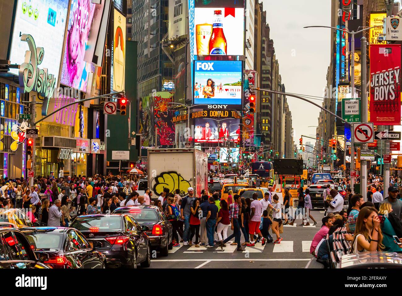 Crowded groups of people crossing the street at Times Square during rush hour Stock Photo