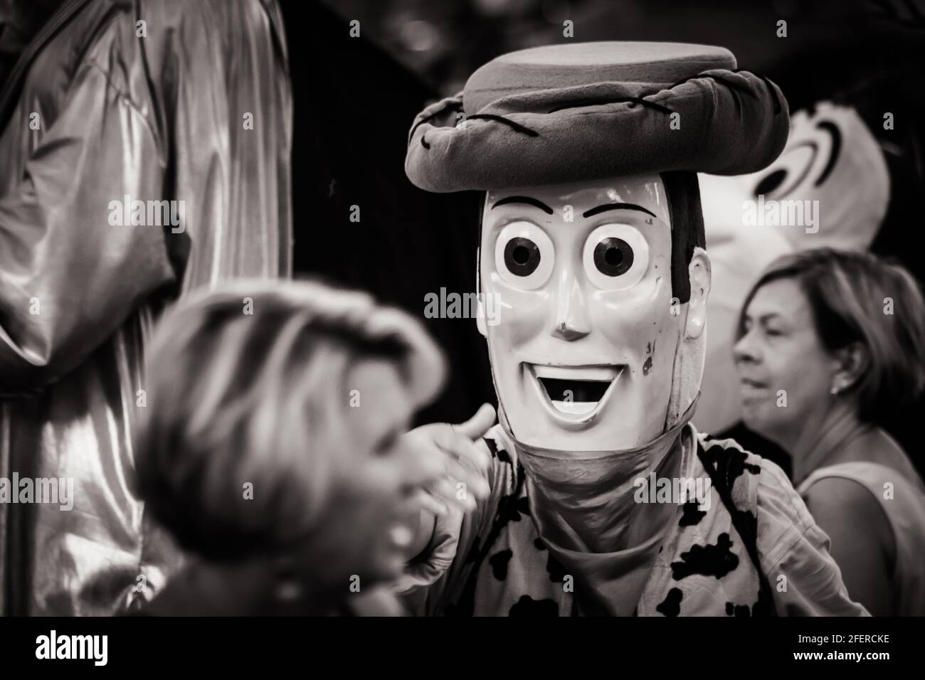 Black and white image of a close up of a man in Sheriff Woody (Toy Story) costume at Times Square Stock Photo