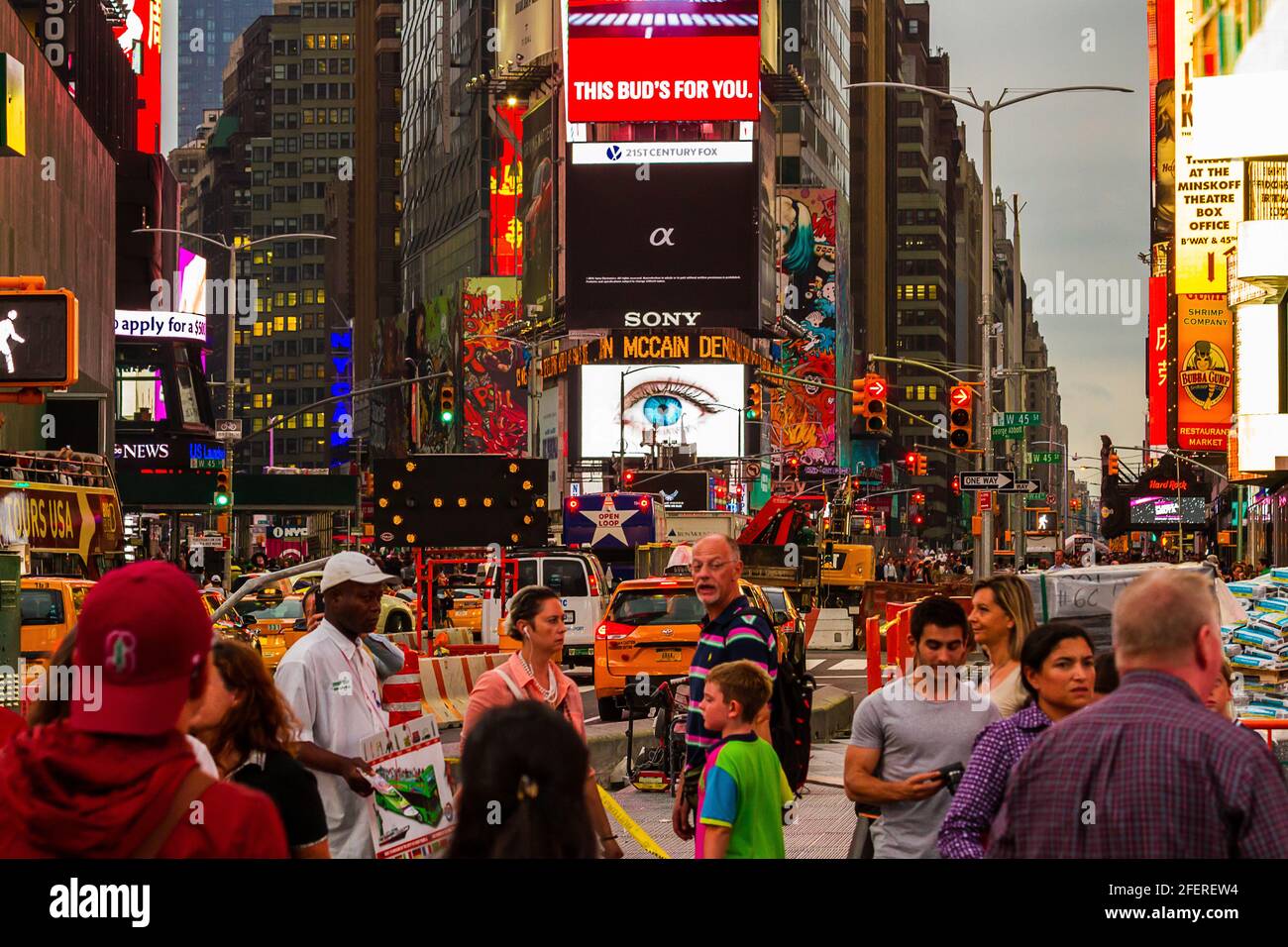 Traffic and people at Times Square on a busy evening Stock Photo