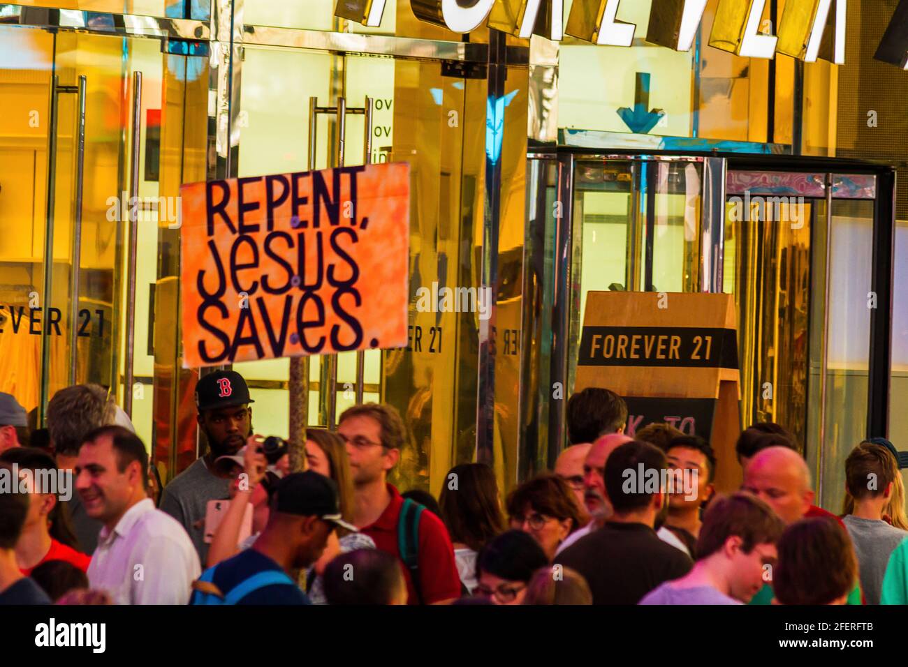 A group of missionary workers carrying 'Repent, Jesus Saves' placard at Times Square Stock Photo