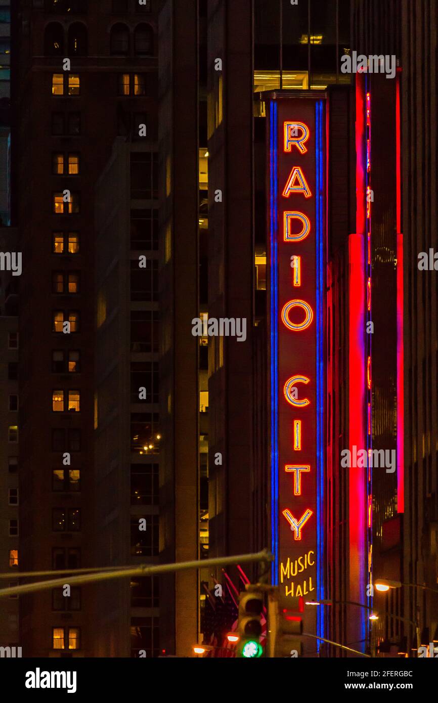 Radio City Music Hall red neon sign at night in New York City Stock