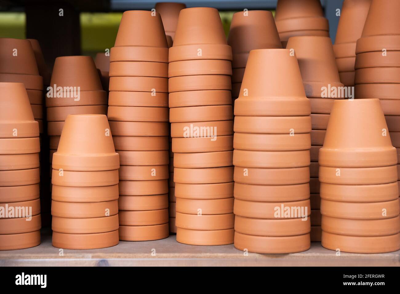 Empty garden Ceramic Decorate Pots in a row on the metal shelf in
