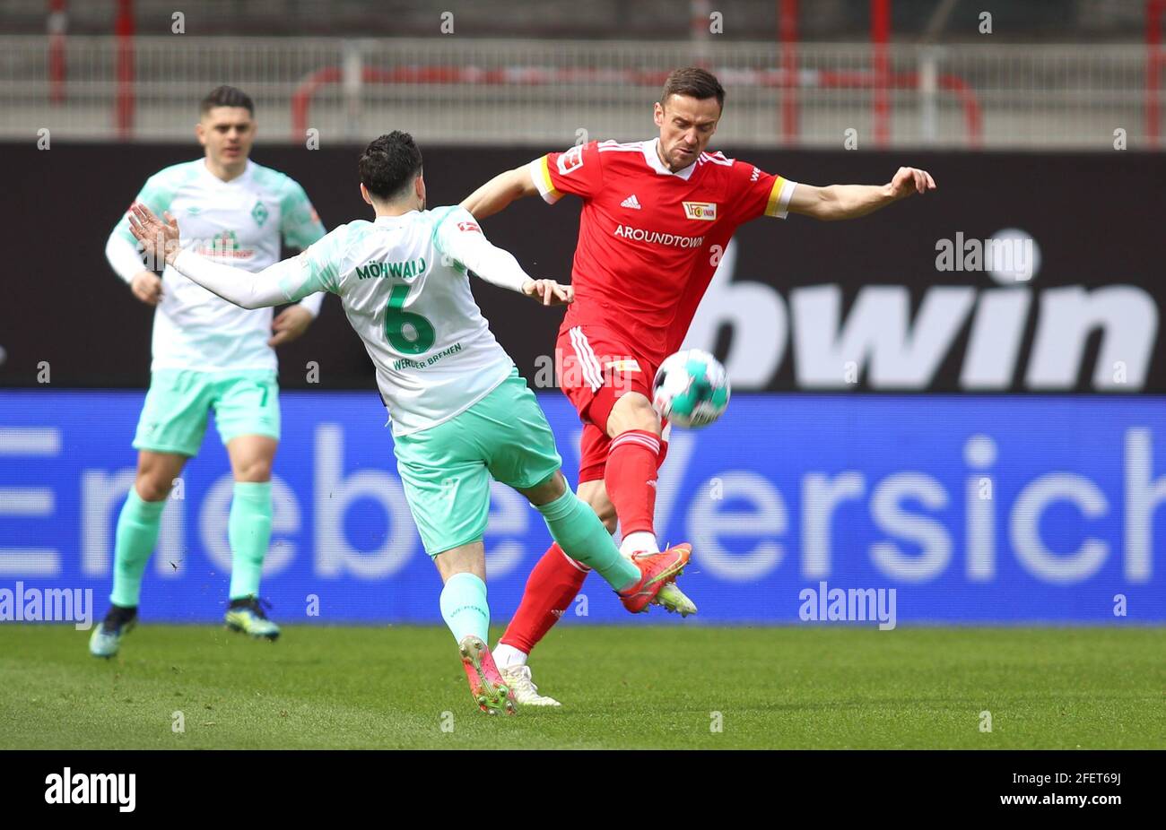 Berlin, Germany. 24th Apr, 2021. Football: Bundesliga, 1. FC Union Berlin - Werder Bremen, Matchday 31 at Stadion An der Alten Försterei. Union's Christian Gentner (r) and Bremen's Kevin Möhwald fight for the ball. IMPORTANT NOTE: In accordance with the regulations of the DFL Deutsche Fußball Liga and the DFB Deutscher Fußball-Bund, it is prohibited to use or have used photographs taken in the stadium and/or of the match in the form of sequence pictures and/or video-like photo series. Credit: Andreas Gora/dpa-Pool/dpa/Alamy Live News Stock Photo