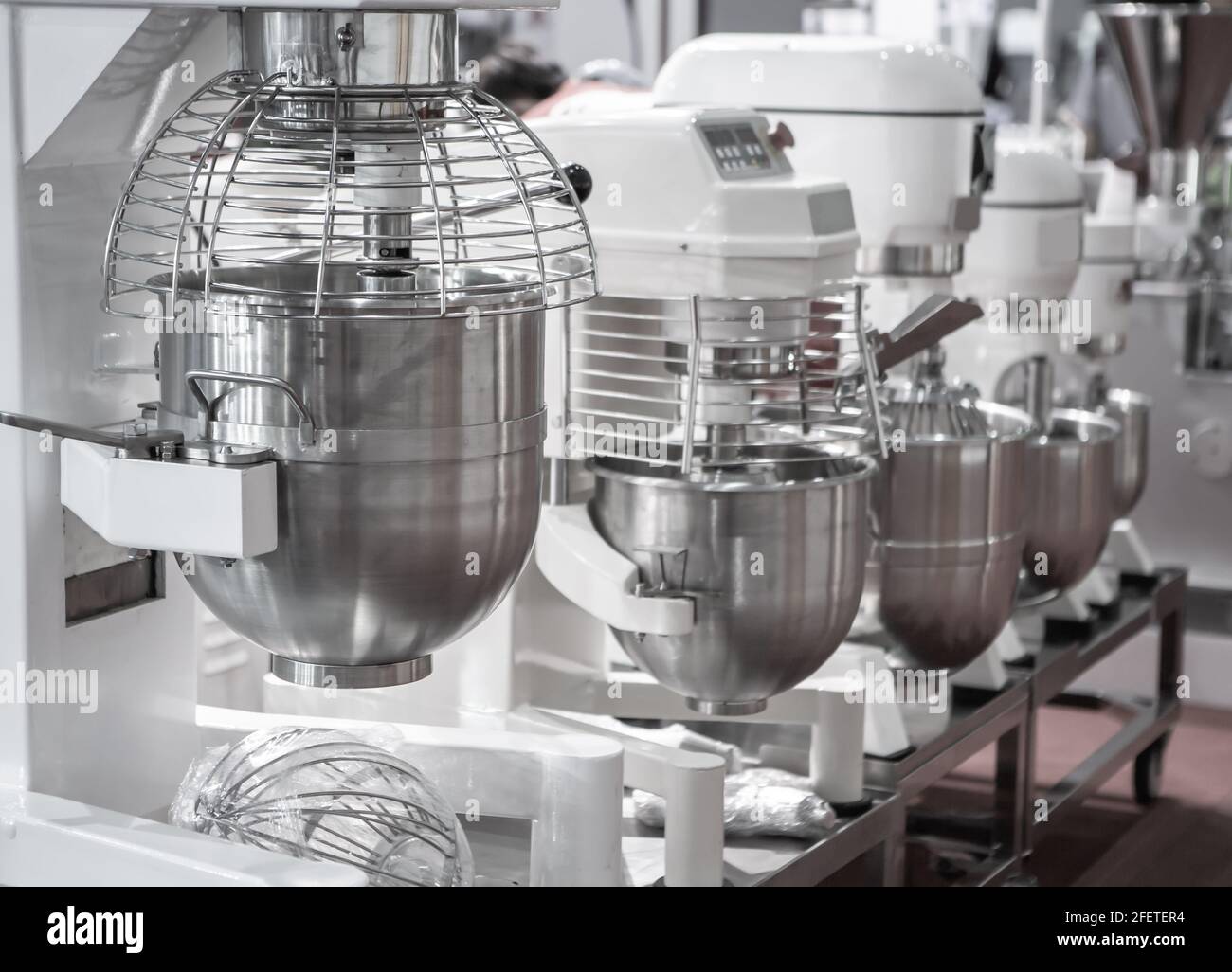 https://c8.alamy.com/comp/2FETER4/close-up-of-commercial-bread-mixer-food-mixing-machine-for-food-industry-2FETER4.jpg