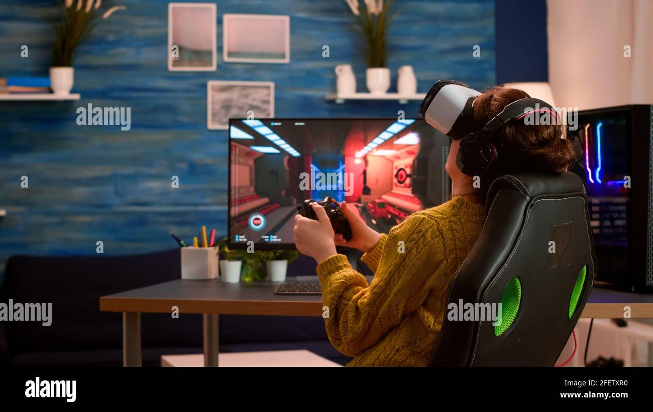 Pro woman egame cyber playing online with virtual reality headset and  wireless controller. Virtual space shooter championship in cyberspace,  esports player performing on pc during gaming tournament Stock Photo - Alamy