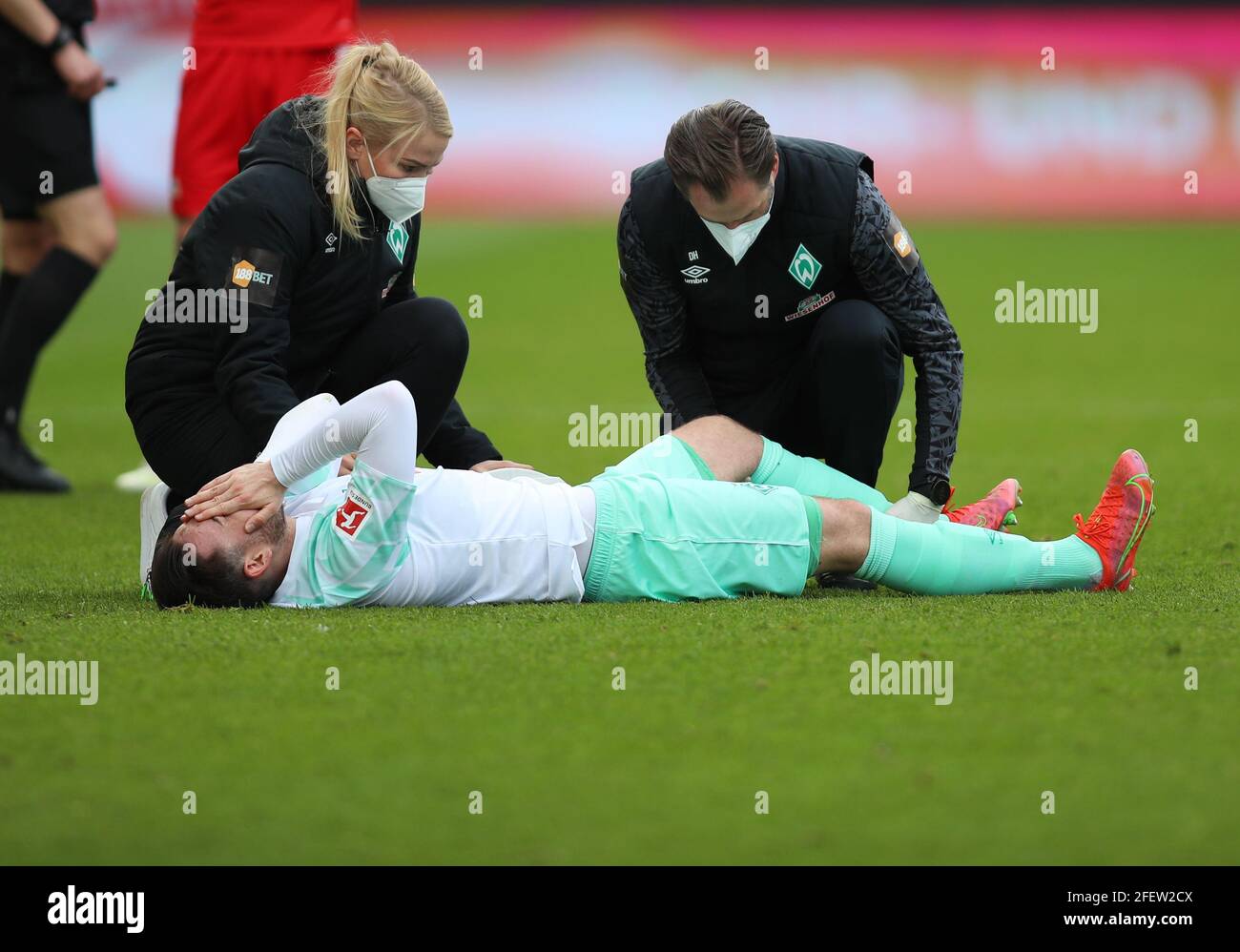 Berlin, Germany. 24th Apr, 2021. Football: Bundesliga, 1. FC Union Berlin - Werder Bremen, Matchday 31 at Stadion An der Alten Försterei. Bremen's Kevin Möhwald is injured on the pitch and requires treatment. IMPORTANT NOTE: In accordance with the regulations of the DFL Deutsche Fußball Liga and the DFB Deutscher Fußball-Bund, it is prohibited to use or have used photographs taken in the stadium and/or of the match in the form of sequence pictures and/or video-like photo series. Credit: Andreas Gora/dpa-Pool/dpa/Alamy Live News Stock Photo