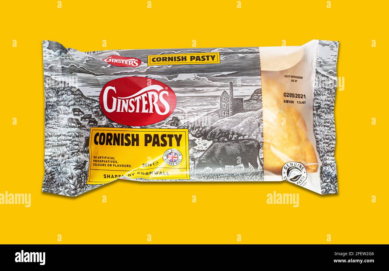 SWINDON, UK - APRIL 24, 2021:  Ginsters Cornish Pasty on a yellow background Stock Photo