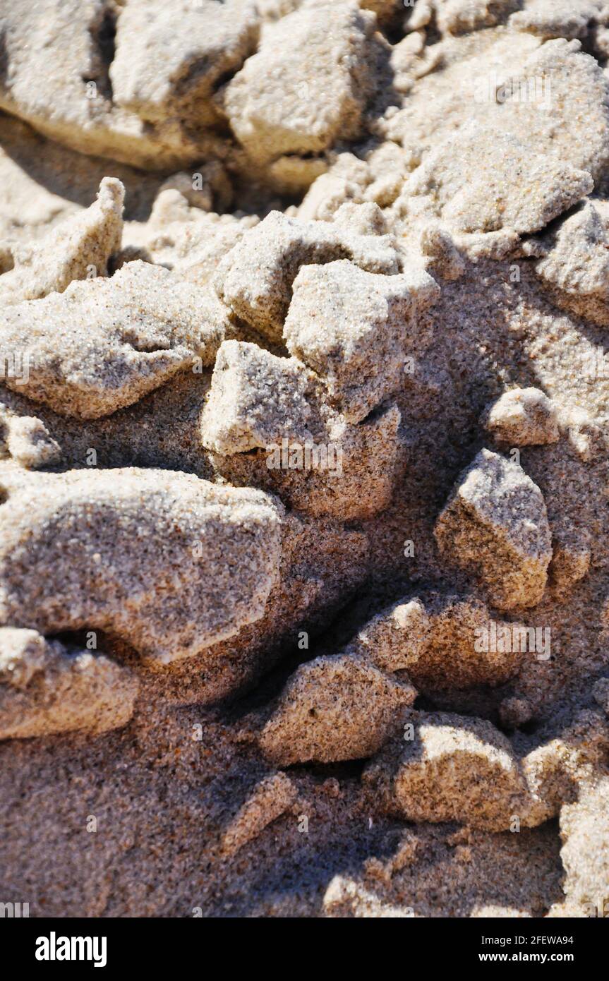 Sandy surface on the beach. This got wet and the surface has a brittle structure. Stock Photo