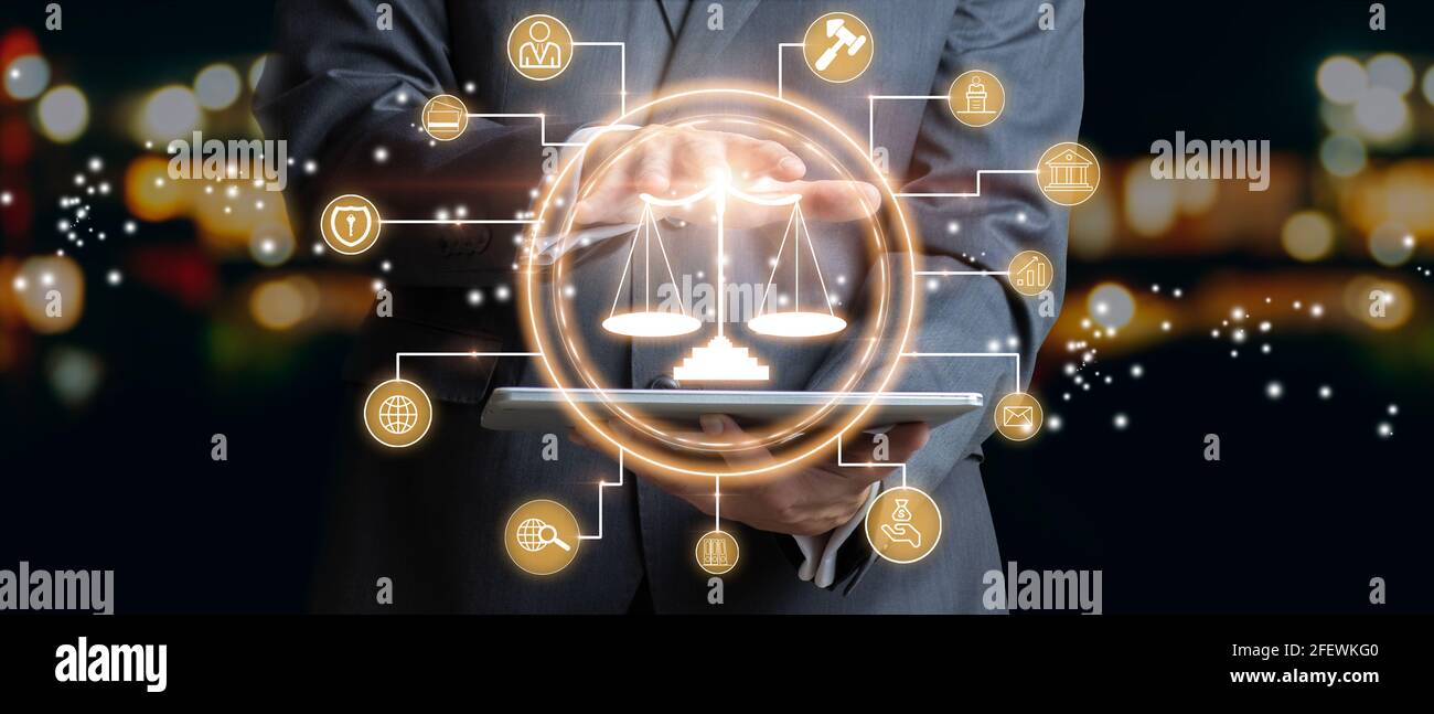 Businessman touching the icon of the balance of justice. Concept of legal advice, law and defense. Mixed media Stock Photo